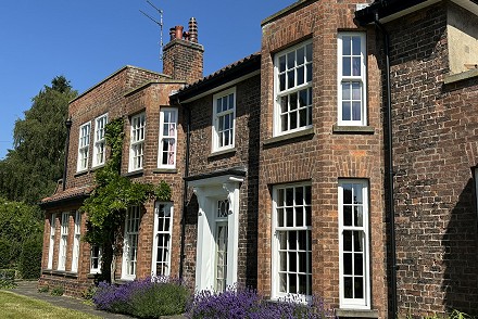 EYG expertise ensures new sliding sash UPVC windows are a perfect match to wooden originals on period property